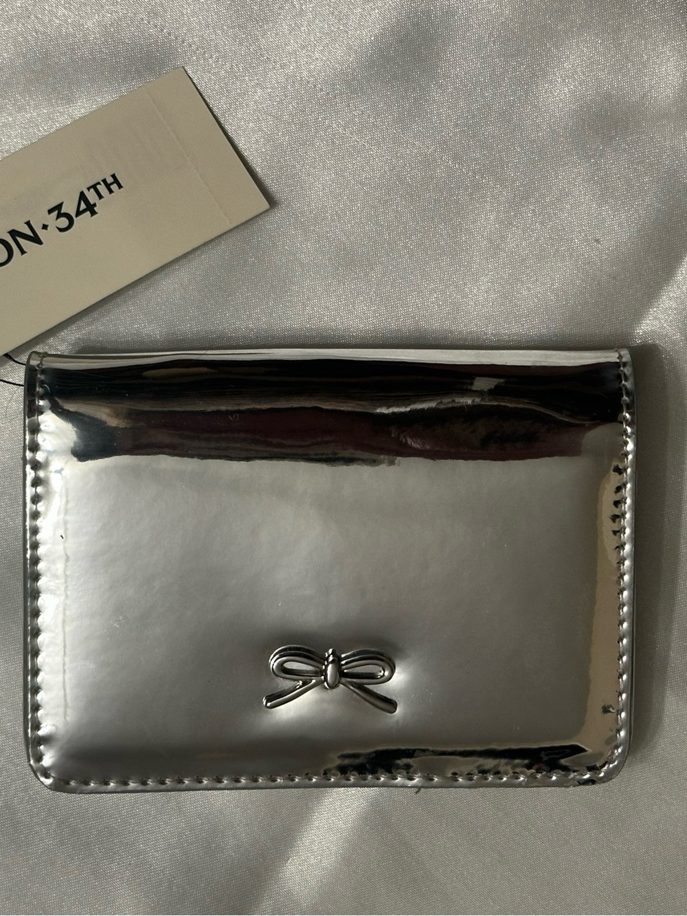 On 34th NWT Joesil Metallic Bi-fold Wallet-Mirror Silver